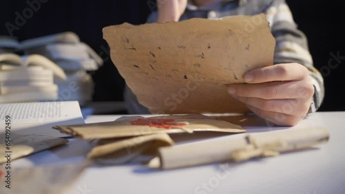 A historian who studies historical artifacts.