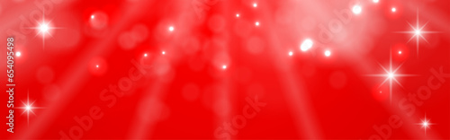 キラキラ光る赤背景のクリスマスバナー、コピースペースあり