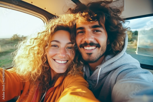 Happy smiling couple making a selfie while on a road trip. Concept of travel, wanderlust and thirst for adventures