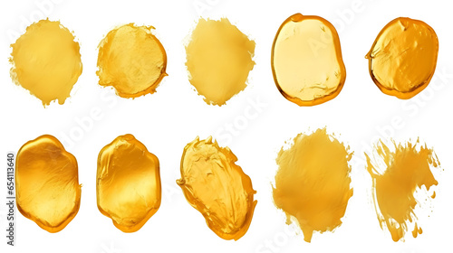 Creative brushstrokes of gold paint isolated on a white background. Gold paint texture.