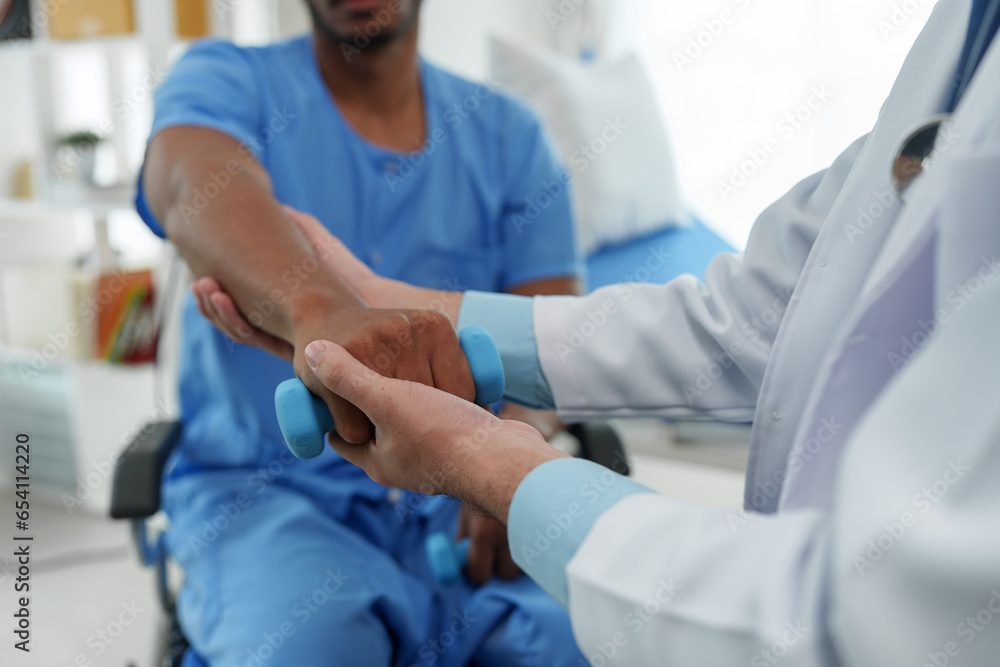 The doctor counsels the patient about pain in the muscles of the arms and elbows. office syndrome problem physical therapy diagnostic concept The doctor counsels the patient about pain in the muscles of the arms and elbows. office syndrome problem physical therapy diagnostic concept