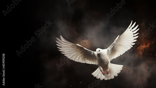 A white pigeon fliying with a dark grunge background copy space