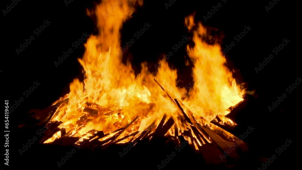 Close up of a large bonfire on the beach at night Close up of a large bonfire on the beach at night