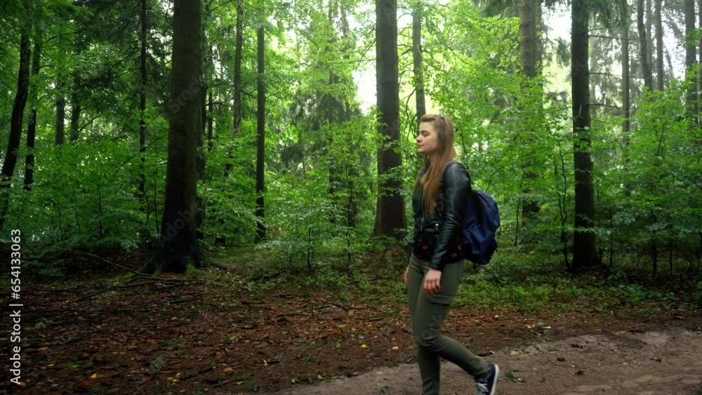 Girls walking through the forest exploring the scenic view alone Girls walking through the forest exploring the scenic view alone