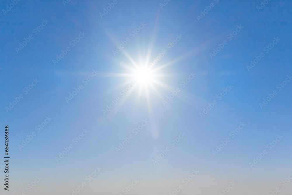 sparkle sun on blue sky background sparkle sun on blue sky background