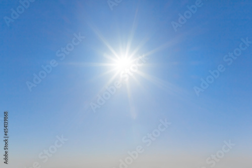 sparkle sun on blue sky background