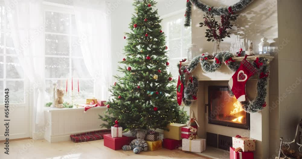 Empty Shot Depicting the Magic of Holidays on a Peaceful Snowy Christmas Morning: Decorated Corner in Modern House with Christmas Tree, Fireplace and Gifts. Home of a Family Celebrating with Joy Empty Shot Depicting the Magic of Holidays on a Peaceful Snowy Christmas Morning: Decorated Corner in Modern House with Christmas Tree, Fireplace and Gifts. Home of a Family Celebrating with Joy