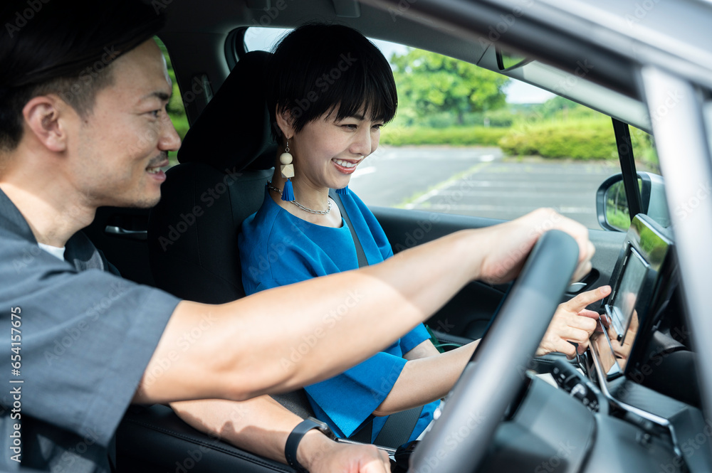 Side view of happy couple enjoying road trip Side view of happy couple enjoying road trip