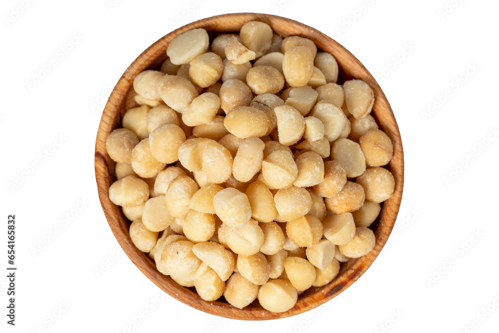 Macadamia nut in wood bowl. Macadamia nuts peeled isolated on white background. Top view Macadamia nut in wood bowl. Macadamia nuts peeled isolated on white background. Top view