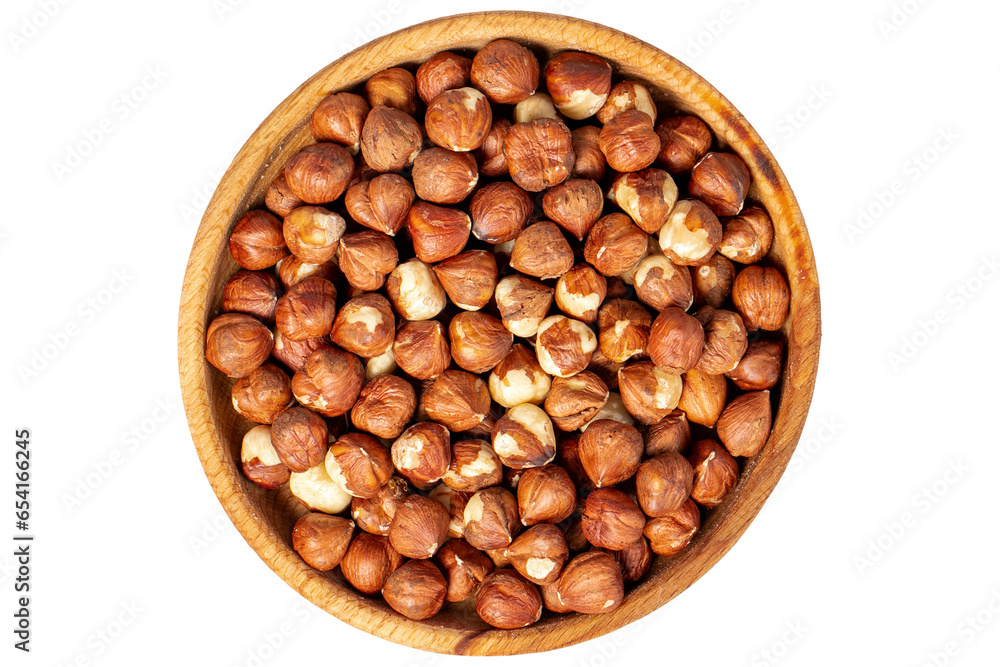 Hazelnuts in wood bowl. Hazelnut kernel isolated on white background. Top view Hazelnuts in wood bowl. Hazelnut kernel isolated on white background. Top view