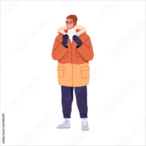 Man in winter clothes, apparel. Modern person standing in jacket, sweater, ha...