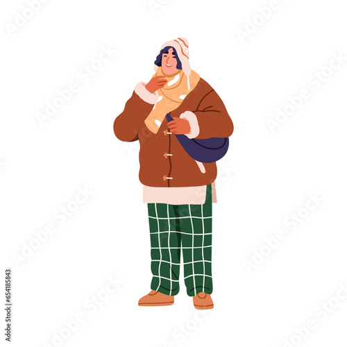 Modern young man in winter apparel, warm hat and jacket, scarf. Trendy stylis...