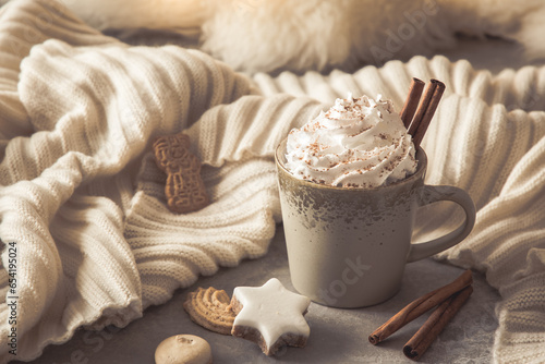 Gray cup of coffee or hot chocolate with cream, cinnamon and christmas cookies