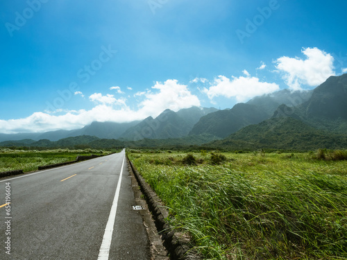 Road and Mountain Scenery in sunny day