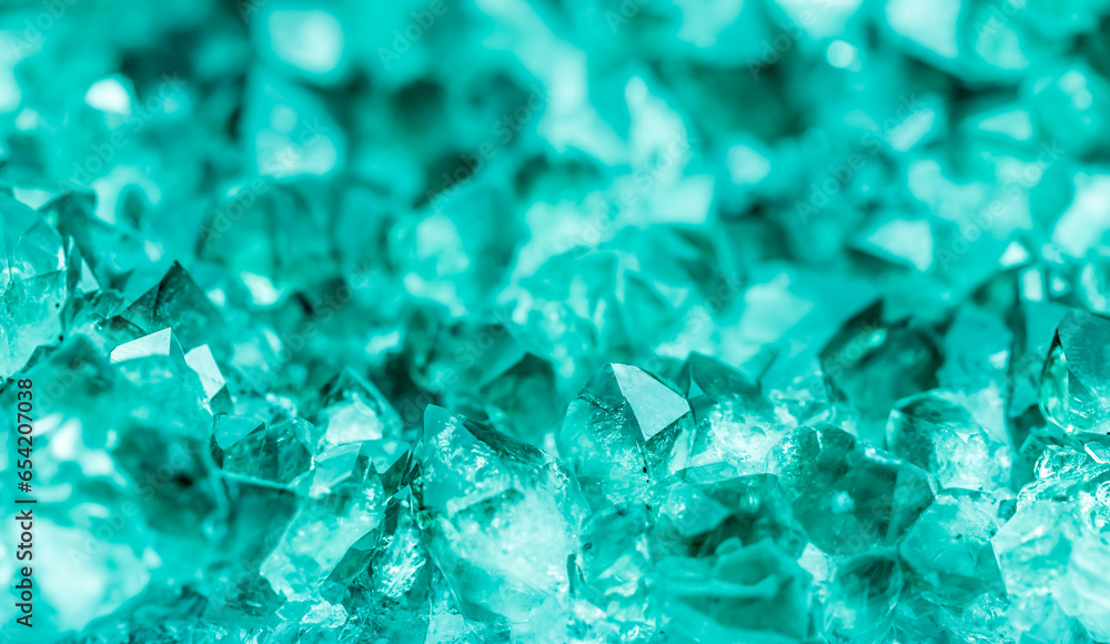 Green crystal mineral stone. Gems. Mineral crystals in the natural environment. Texture of precious and semiprecious stones. Seamless background with copy space colored shiny surface of precious stone Green crystal mineral stone. Gems. Mineral crystals in the natural environment. Texture of precious and semiprecious stones. Seamless background with copy space colored shiny surface of precious stone