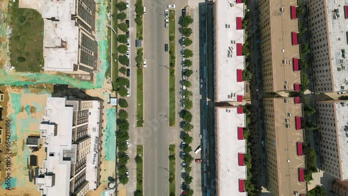 Bird-eye aerial over residential area with apartments, urban landscape in Huayin, a city nestled in the heart of Shaanxi Province, China. City's rapid development and growth concept. Sunshine day. photo