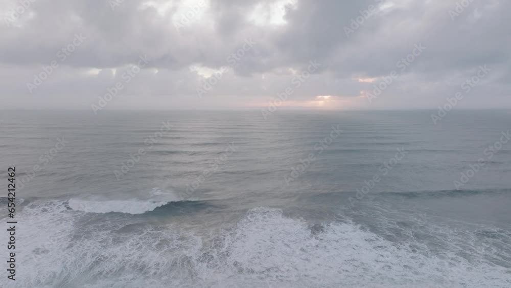 Aerial of ocean waves crashing on Iceland Sólheimasandur black sand beach, on a cloudy day Aerial of ocean waves crashing on Iceland Sólheimasandur black sand beach, on a cloudy day