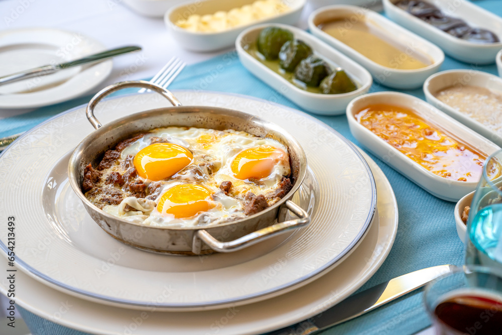 Turkish scrambled eggs Turkish name Kavurmali Yumurta with roasted meat in copper pan Turkish scrambled eggs Turkish name Kavurmali Yumurta with roasted meat in copper pan