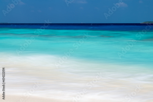 beach with white sand and crystal water maldives