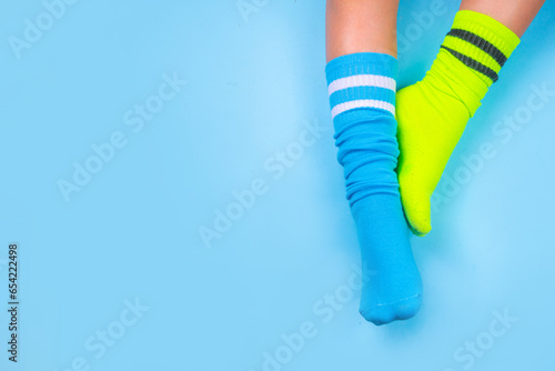 Child legs in mismatched socks