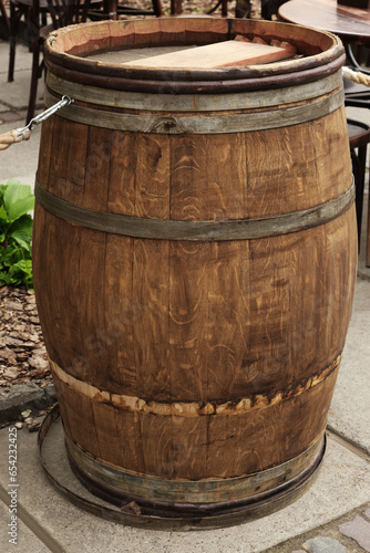 Traditional wooden barrel on city street outdoors