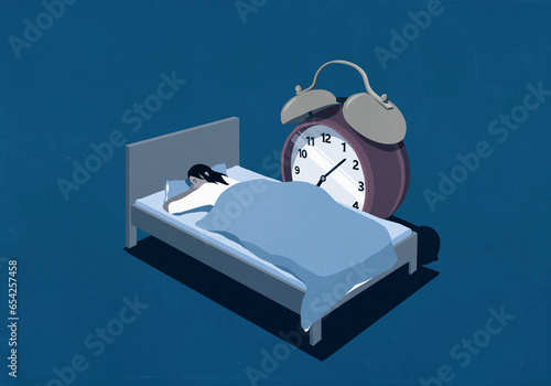 Large alarm clock next to woman sleeping in bed
