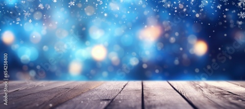 Beautiful winter snowy blurred defocused blue background and empty wooden floor. photo