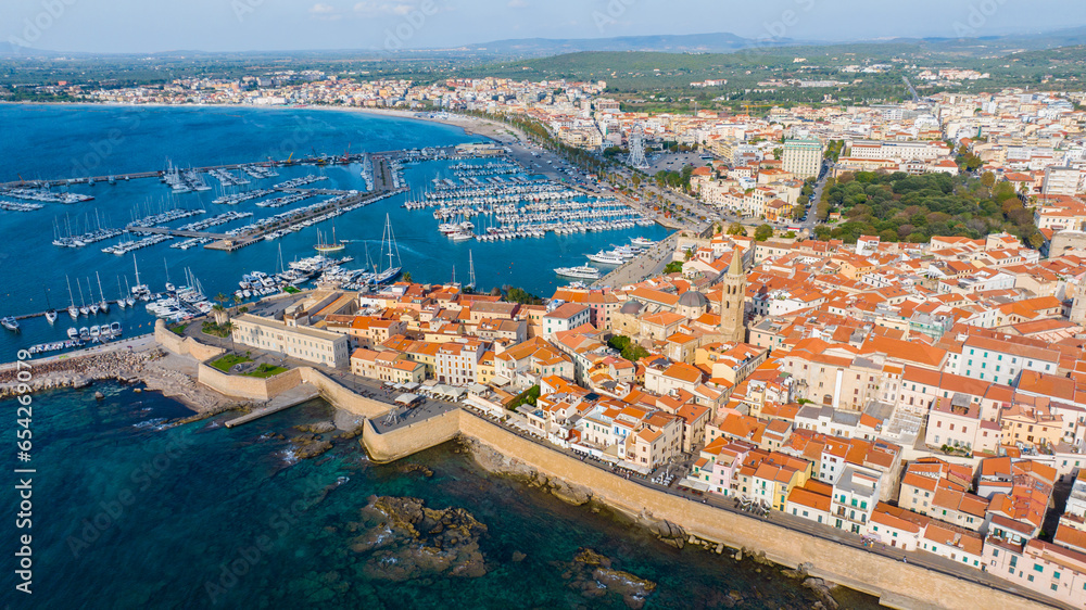Aerial view of the old town of Alghero in Sardinia. Photo taken with a drone on a sunny day. Panoramic view of the old town and harbor of Alghero, Sardinia, Italy.
