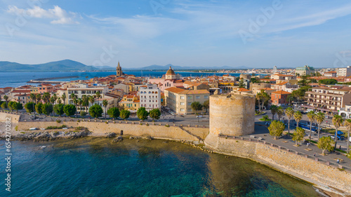Aerial view of the old town of Alghero in Sardinia. Photo taken with a drone on a sunny day. Panoramic view of the old town and harbor of Alghero, Sardinia, Italy. photo