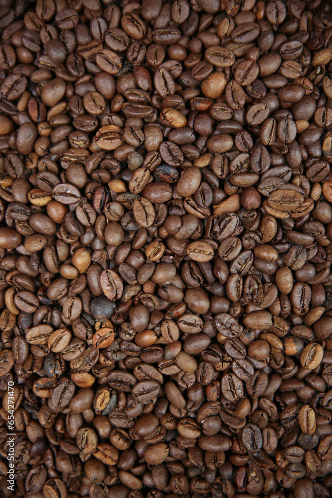 Overhead view of backdrop representing halves of dark brown coffee beans. Texture of coffee beans Overhead view of backdrop representing halves of dark brown coffee beans. Texture of coffee beans
