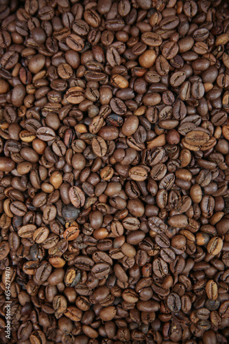 Overhead view of backdrop representing halves of dark brown coffee beans. Texture of coffee beans 