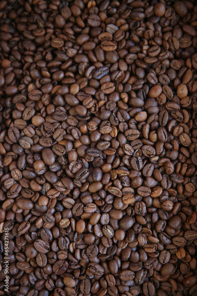 Overhead view of backdrop representing halves of dark brown coffee beans. Texture of coffee beans Overhead view of backdrop representing halves of dark brown coffee beans. Texture of coffee beans