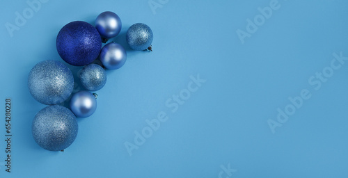 blue Christmas balls on a blue background. view from above.