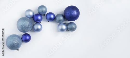 blue Christmas balls on a white background. view from above.