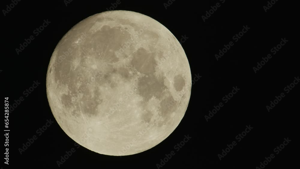 Full moon - supermoon moves through the night sky Full moon - supermoon moves through the night sky