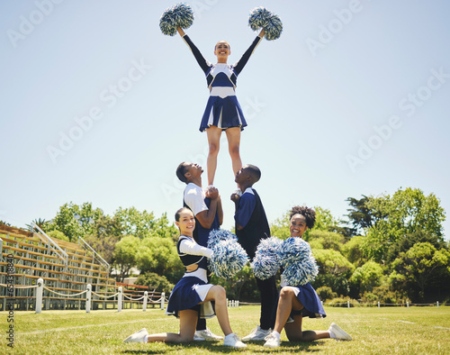 Cheerleader team portrait, smile and formation of people for performance on field outdoor in training, balance or exercise. Happy, cheerleading group and support at event, sport competition or mockup