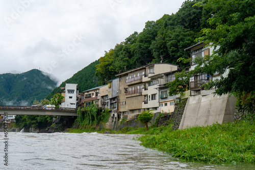 Gujo Hachiman , small riverside castle town during rainy day at Gujo Hachiman Gifu , Japan : 30 August 2019 . photo