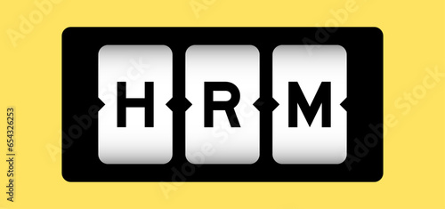 Black color in word HRM (Abbreviation of human resource management) on slot banner with yellow color background