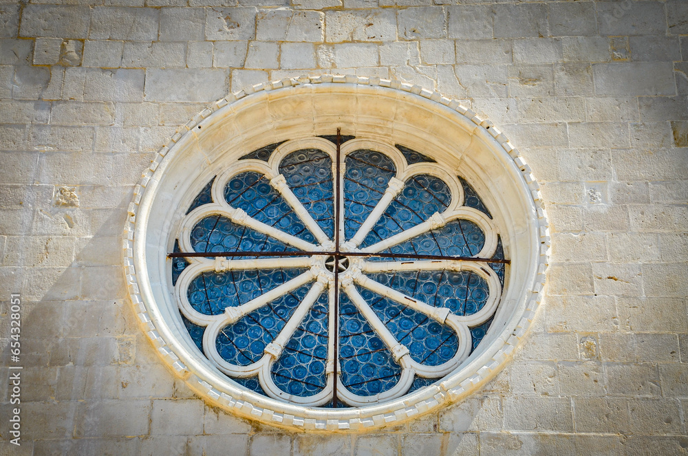 decorative window - rosette in the church building in Trogir