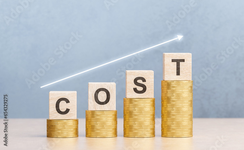 Cost increase Concept. Cost text with up arrow. increase in cost of product services, modernization, credit products photo