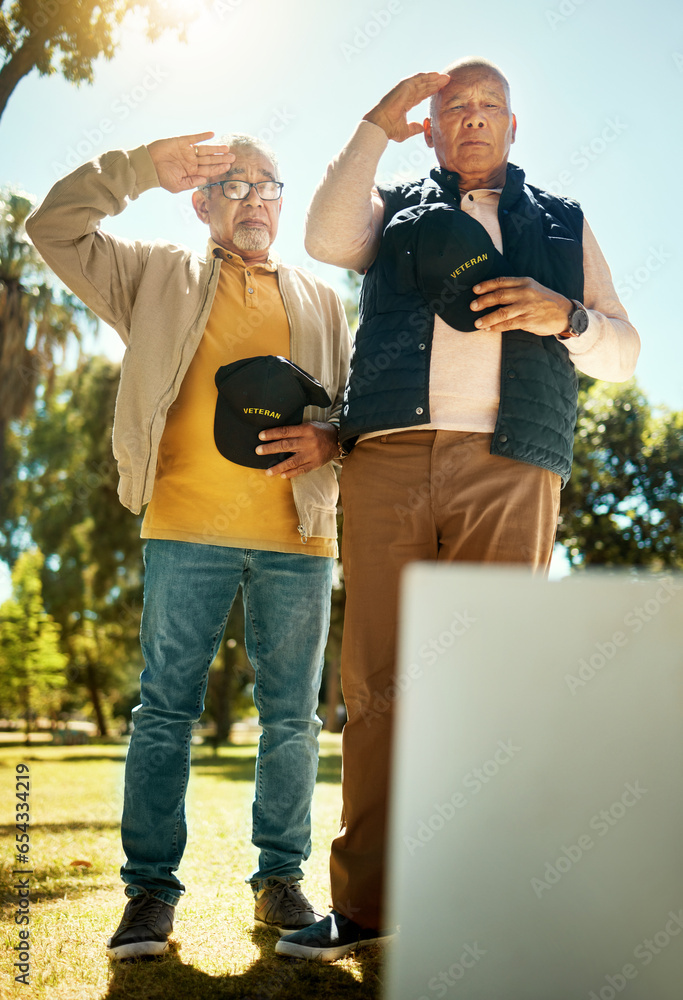 Naklejka premium Men, salute and tombstone for respect in cemetery for military, navy or memorial with grief, support or empathy. Elderly friends, gravestone and hats off with sign, memory and love for fallen soldier