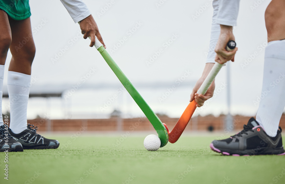 Fototapeta premium Fitness, hockey and women with sticks and ball on field for training, competition or challenge outdoor. Sports, person and legs on grass with workout, battle or exercise for wellness in nature