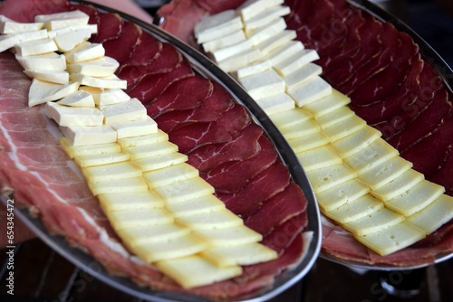 Montenegrin traditional food, Prshut and cheese on a metal tray photo