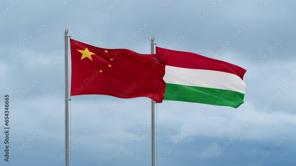 Hungary flag and China flag waving together on cloudy sky, endless seamless loop, two country relations concept Hungary flag and China flag waving together on cloudy sky, endless seamless loop, two country relations concept