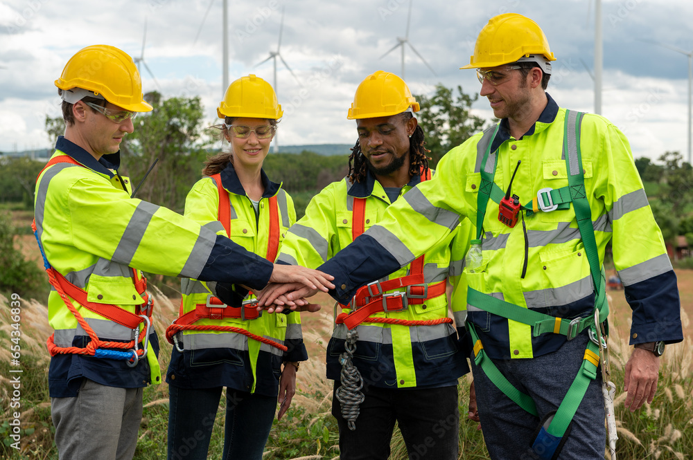Engineering people are meeting at electrical turbines field, Engineering people, corporate working, teamwork concept Engineering people are meeting at electrical turbines field, Engineering people, corporate working, teamwork concept