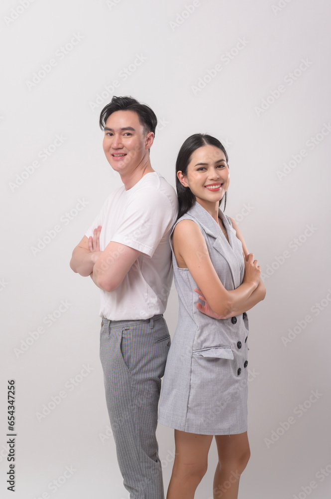 Young Asian couple smiling over white background Young Asian couple smiling over white background