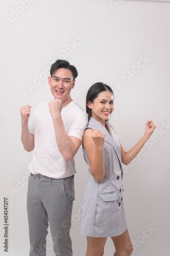 Young Asian couple smiling over white background