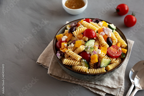 Homemade Organic Greek Pasta Salad in a Bowl, side view. Copy space.