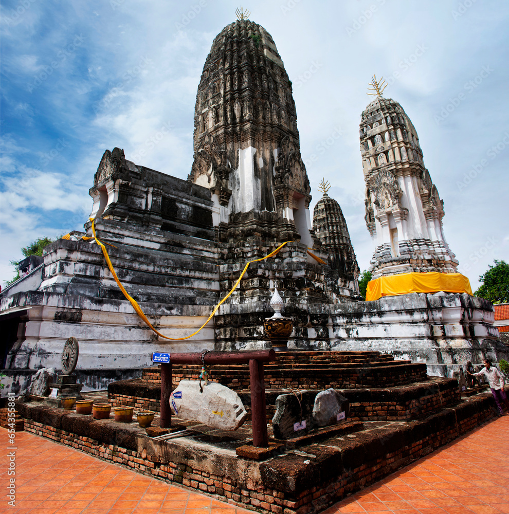 Ancient Na Phra That stupa and ruins chedi prang of Wat Mahathat