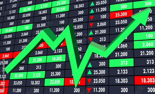 green arrow upwards on the display screen economic stock trading business figures 